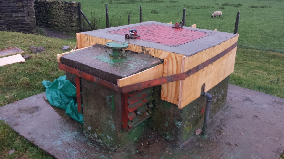 Hatch surround re-concreted in monsoon rain.